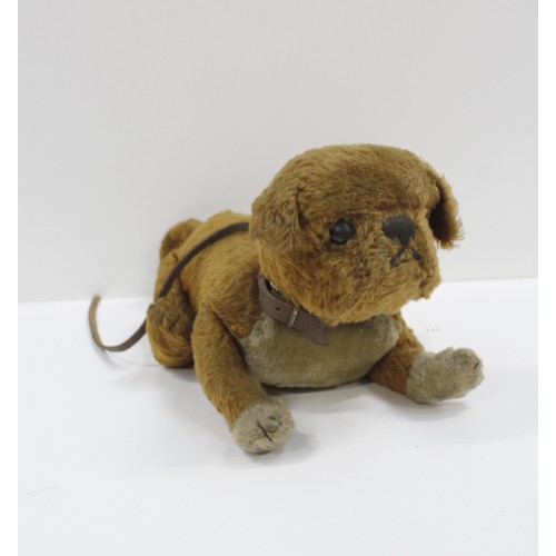 320 - An Unusual Steiff straw filled mohair dog soft toy, possibly a pug, with button ear and leather coll... 