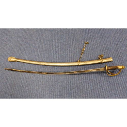 655 - Reproduction carved  Indian sword with pierced brass guard and wrapped leather handle.