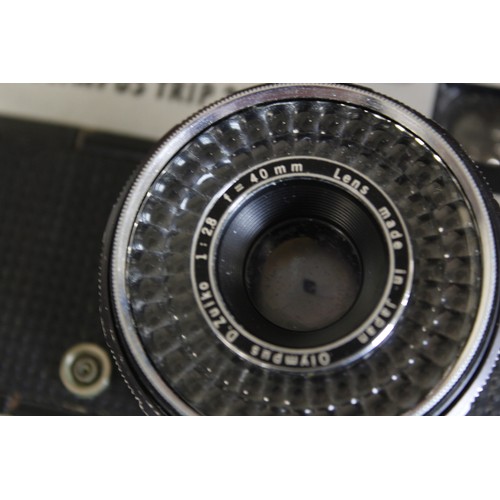 379 - Selection of vintage film and digital cameras to include two digital Olympus cameras, two Olympus Tr... 