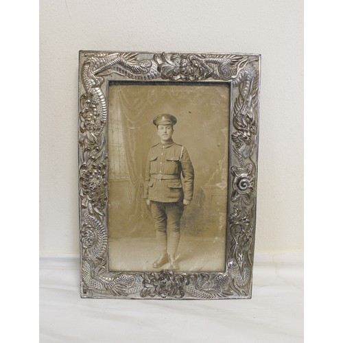 133B - Four photographs relating to J.J Twentyman D.C.M to include a studio photograph of Twentyman in army... 