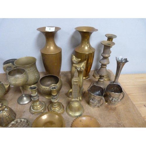 1 - Pair of brass candlesticks, a pair of brass vases and another pieces of decorative brassware