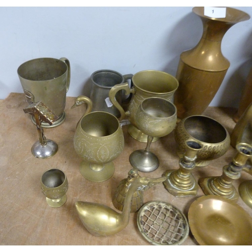 1 - Pair of brass candlesticks, a pair of brass vases and another pieces of decorative brassware