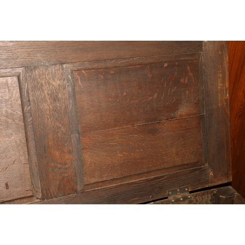 454 - Antique oak hinge top blanket box chest with carved fielded triple panel front raised on straight su... 