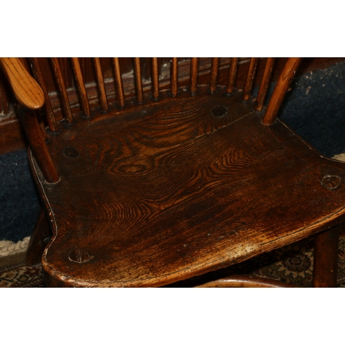 458 - Antique elm Windsor style arm chair with spindle back above saddled seat raised on turned supports