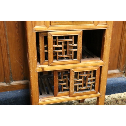 469 - Antique Chinese soft wood chicken coup cabinet of typical form with pierced doors raised on square s... 