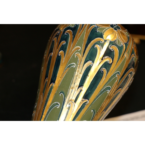 261 - Pair of MacIntyre Moorcroft Burslem Florian ware vases with pipelined decoration of gilded flowers a... 