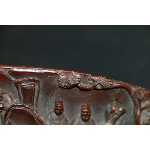 350 - 19th century Chinese carved rhinocerous horn libation cup carved to the exterior with figures on hor... 