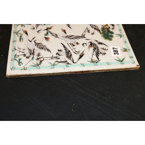 387 - Late 19th Century Chinese famille rose tile decorated with multiple cranes surrounding an old pine t... 