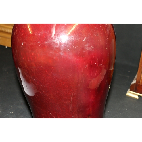 389 - A large 19th century Chinese flambé glazed baluster vase with deep red glaze and flaring to a white ... 