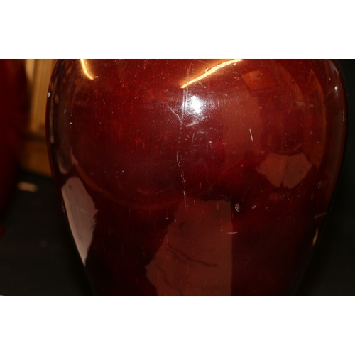 389 - A large 19th century Chinese flambé glazed baluster vase with deep red glaze and flaring to a white ... 