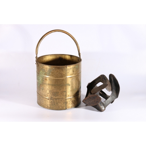 118 - Brass swing-handled bucket and two cobblers lasts.