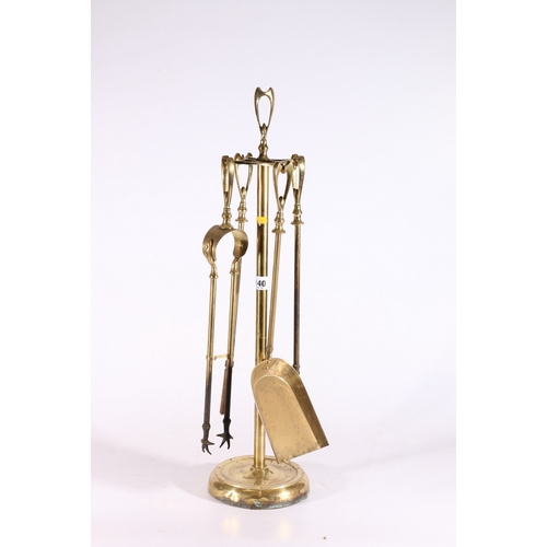 140 - Brass companion set on stand.