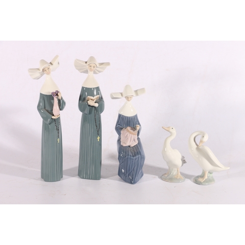 54 - Three Lladro figures of females and two Lladro geese.