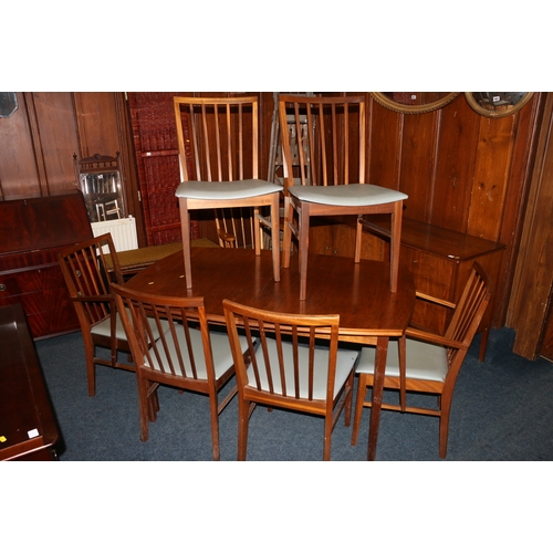 554 - Vanson of Great Britain teak dining table and six chairs.