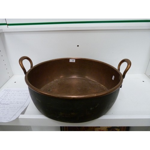 33 - Large twin handled copper pan.