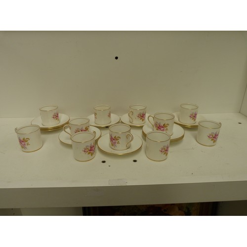 42 - Aynsley floral decorated coffee cans and saucers.