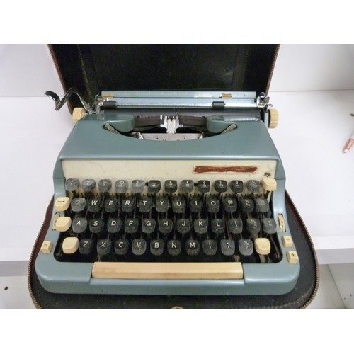 120 - Typewriter in leather case.