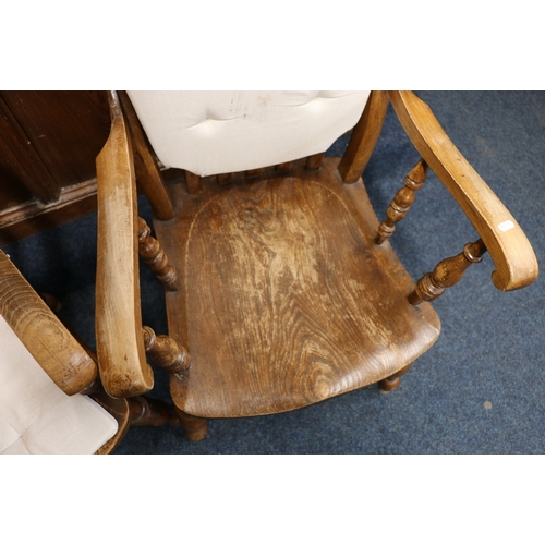 474 - Pair of antique elm armchairs with recurved spar back, scroll arms, saddled seats raised on turned s... 