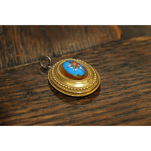 126 - Victorian unhallmarked yellow metal mourning pendant of oval from with blue enamelled cabochon to th... 