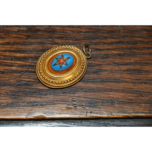 126 - Victorian unhallmarked yellow metal mourning pendant of oval from with blue enamelled cabochon to th... 