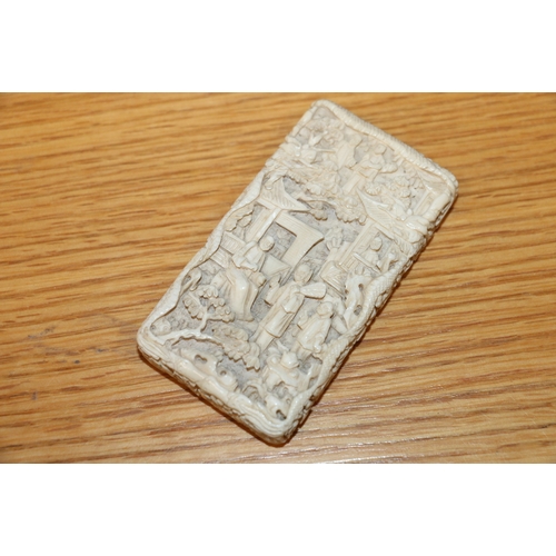 401 - 19th century Chinese export ivory visiting card case, the outside carved with figures in a pavilion ... 