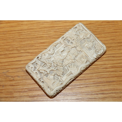 401 - 19th century Chinese export ivory visiting card case, the outside carved with figures in a pavilion ... 