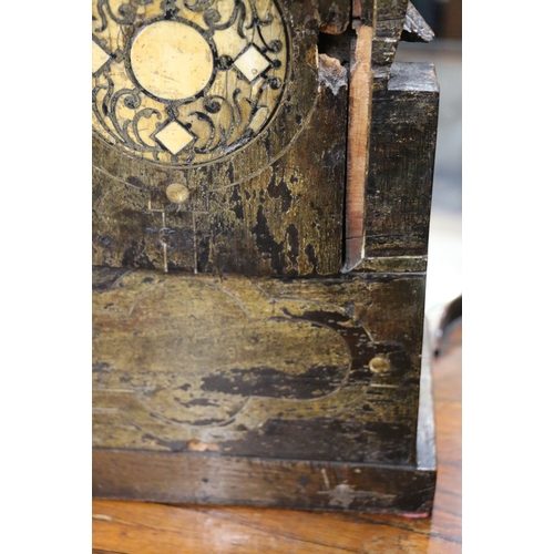 304 - An unusual carved mahogany death clock, the brass dial with gravestone supported by eagle, skull and... 