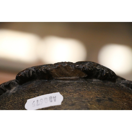 304 - An unusual carved mahogany death clock, the brass dial with gravestone supported by eagle, skull and... 