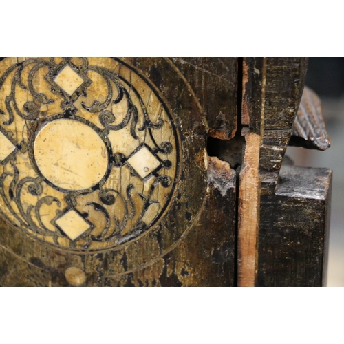 304 - An unusual carved mahogany death clock, the brass dial with gravestone supported by eagle, skull and... 