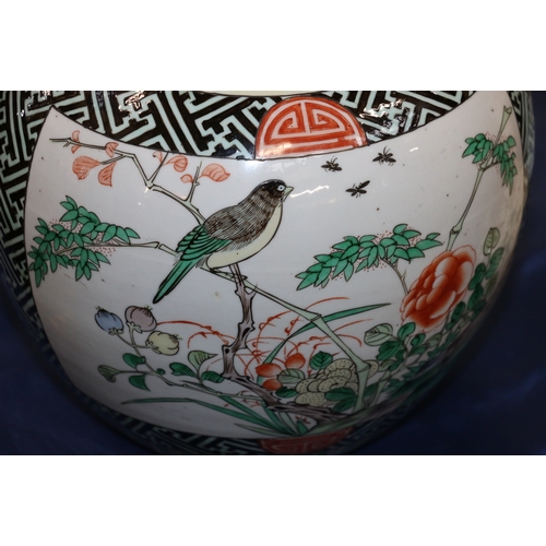 405 - Chinese famille verte ginger jar and cover, the body decorated with birds amongst flowers on a diape... 