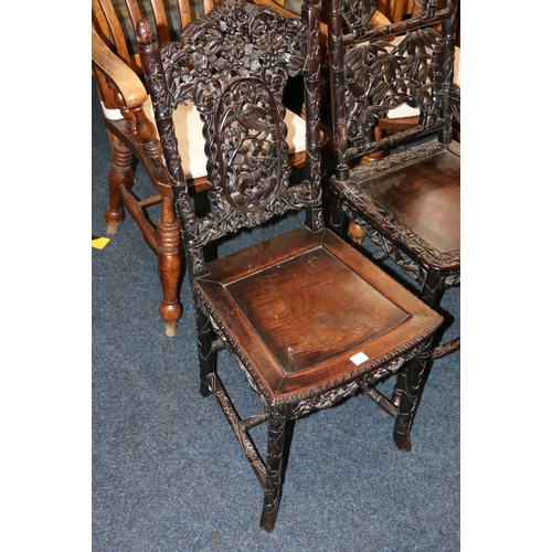 478 - Two antique Chinese padauk wood side chairs, both profusely carved and pierced with designs of birds... 