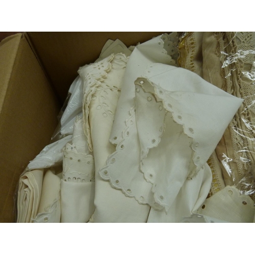 181 - Box of vintage linens including tea cosies, table cloths etc.