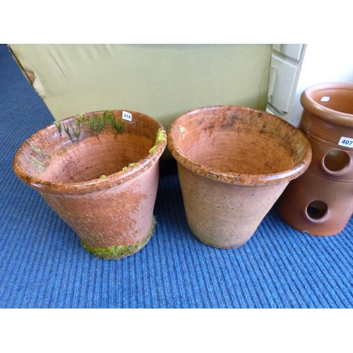 414 - Two large terracotta flower pots.