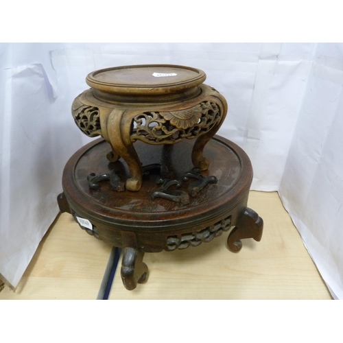 10 - Five assorted carved wood oriental vase stands.