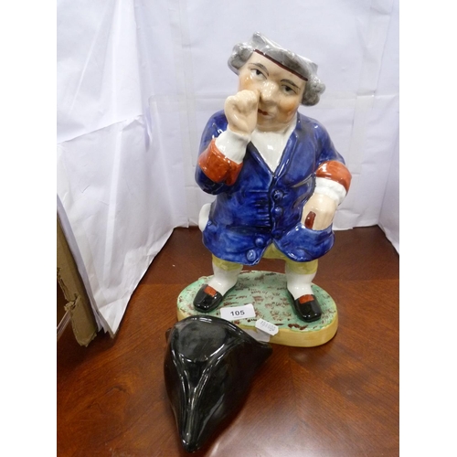 105 - Staffordshire style figure of a gentleman taking snuff.