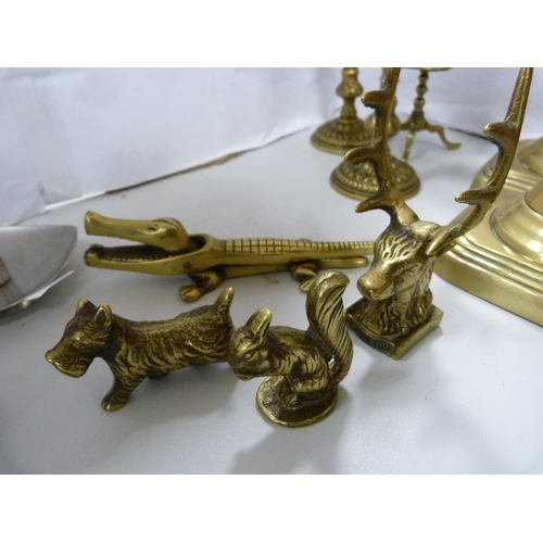 16 - Pair of brass candlesticks, pair of squat candlesticks, nutcrackers etc.