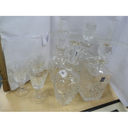 160 - Four decanters and three crystal glasses.