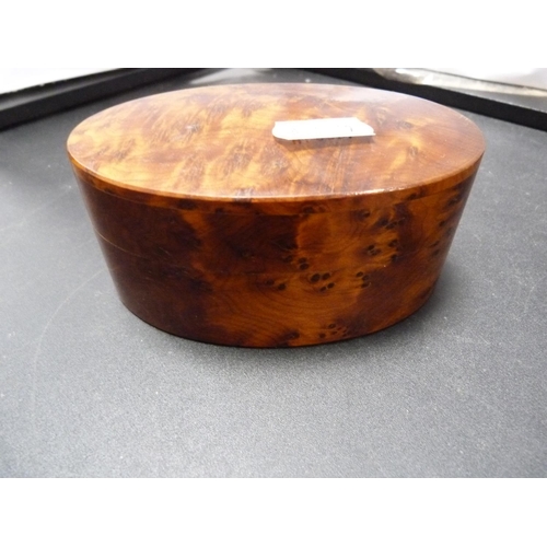 182 - Thuya wood oval box and a copper and white metal cigarette box decorated with scrolling floral leave... 