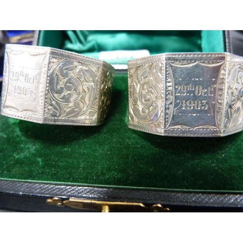 191 - Pair of cased silver octagonal napkin rings, '29th October 1903', and another two pairs of napkin ri... 