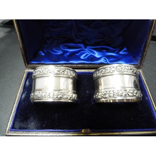 191 - Pair of cased silver octagonal napkin rings, '29th October 1903', and another two pairs of napkin ri... 