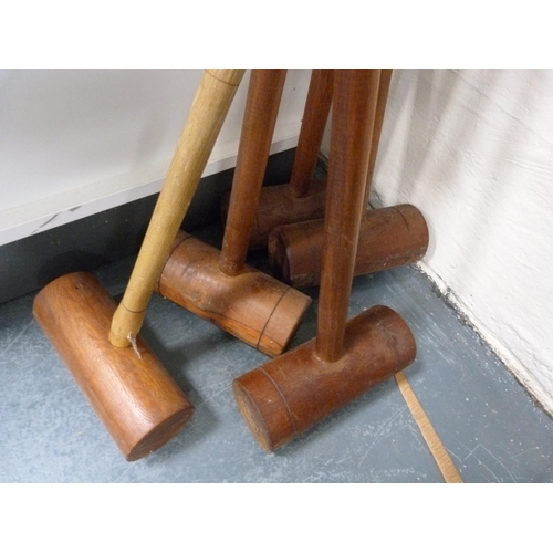 216 - Five croquet mallets.