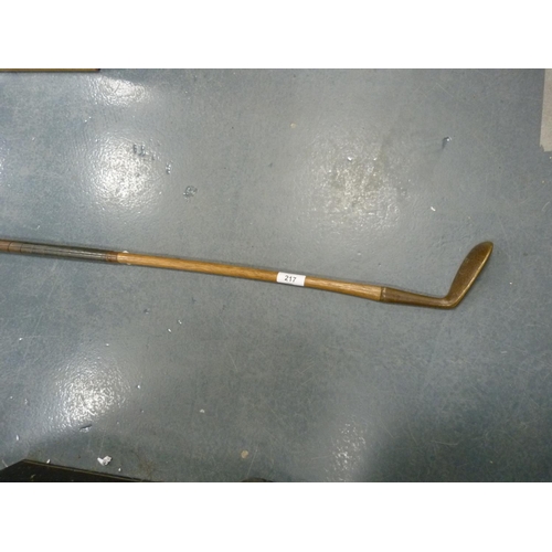 217 - Brass head putter, Glasgow, hickory shaft with leather grip.