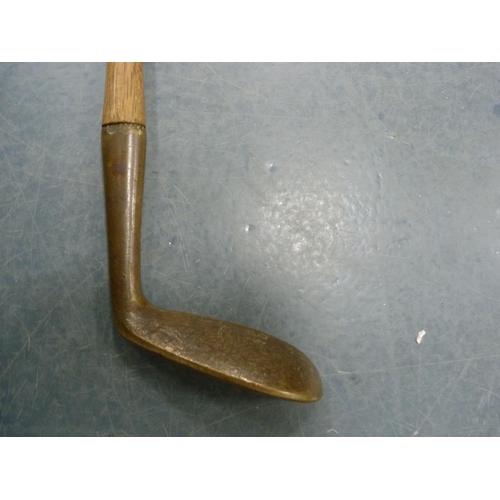 217 - Brass head putter, Glasgow, hickory shaft with leather grip.