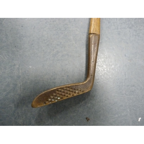 217 - Brass head putter, Glasgow, hickory shaft with leather grip.