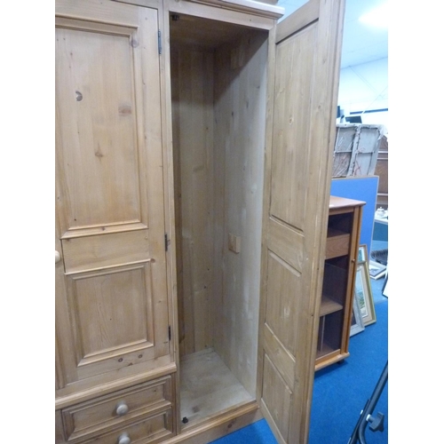 318 - Pine three-door wardrobe.