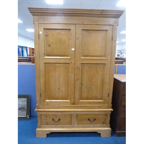 320 - Pine two-door wardrobe with drawers to the base.