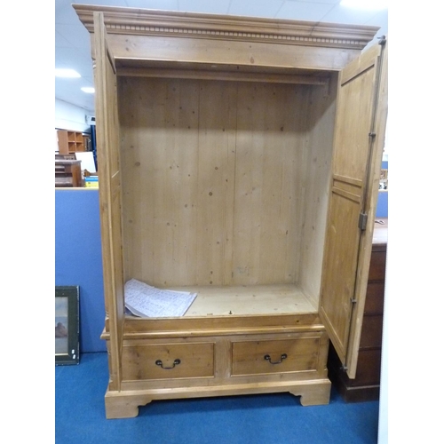 320 - Pine two-door wardrobe with drawers to the base.