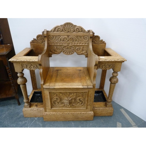 329 - Victorian oak umbrella stand with central hinged lid seat.