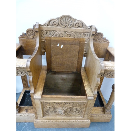 329 - Victorian oak umbrella stand with central hinged lid seat.