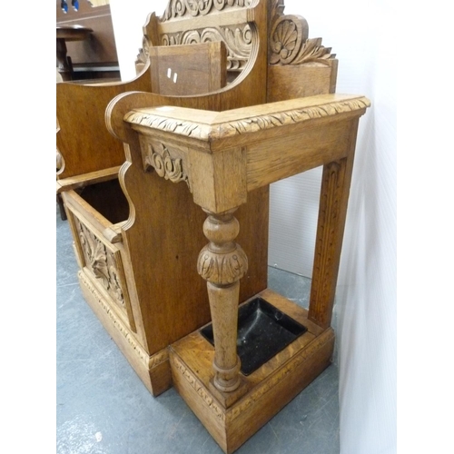 329 - Victorian oak umbrella stand with central hinged lid seat.